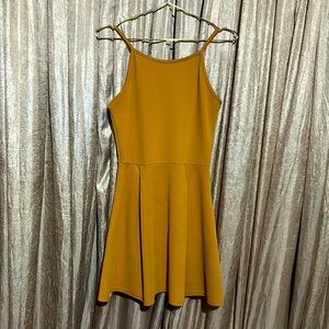 Mustard colored mid-thigh length halter dress